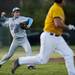 Skyline junior Ben Sadis throws to first in the second game against Chelsea on Monday, April 22. Skyline won the second game 5-2. Daniel Brenner I AnnArbor.com